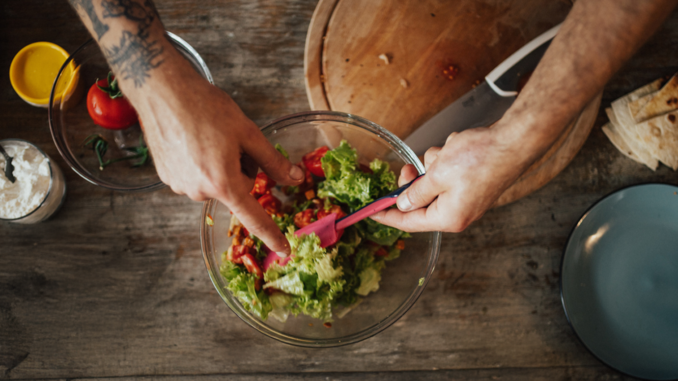 Morning salad being prepared in a bowl. 