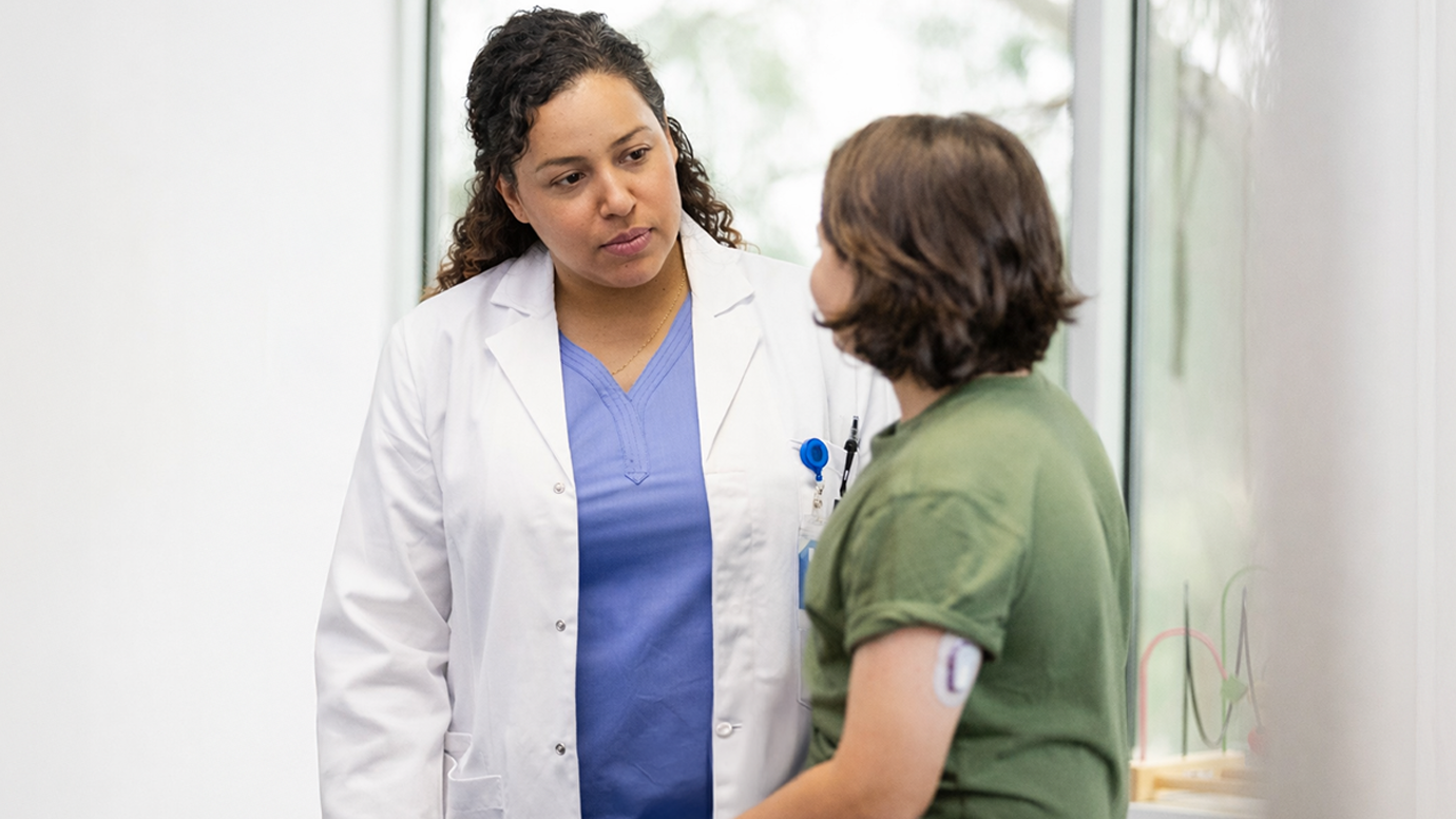 Medical professional speaks with a patient.
