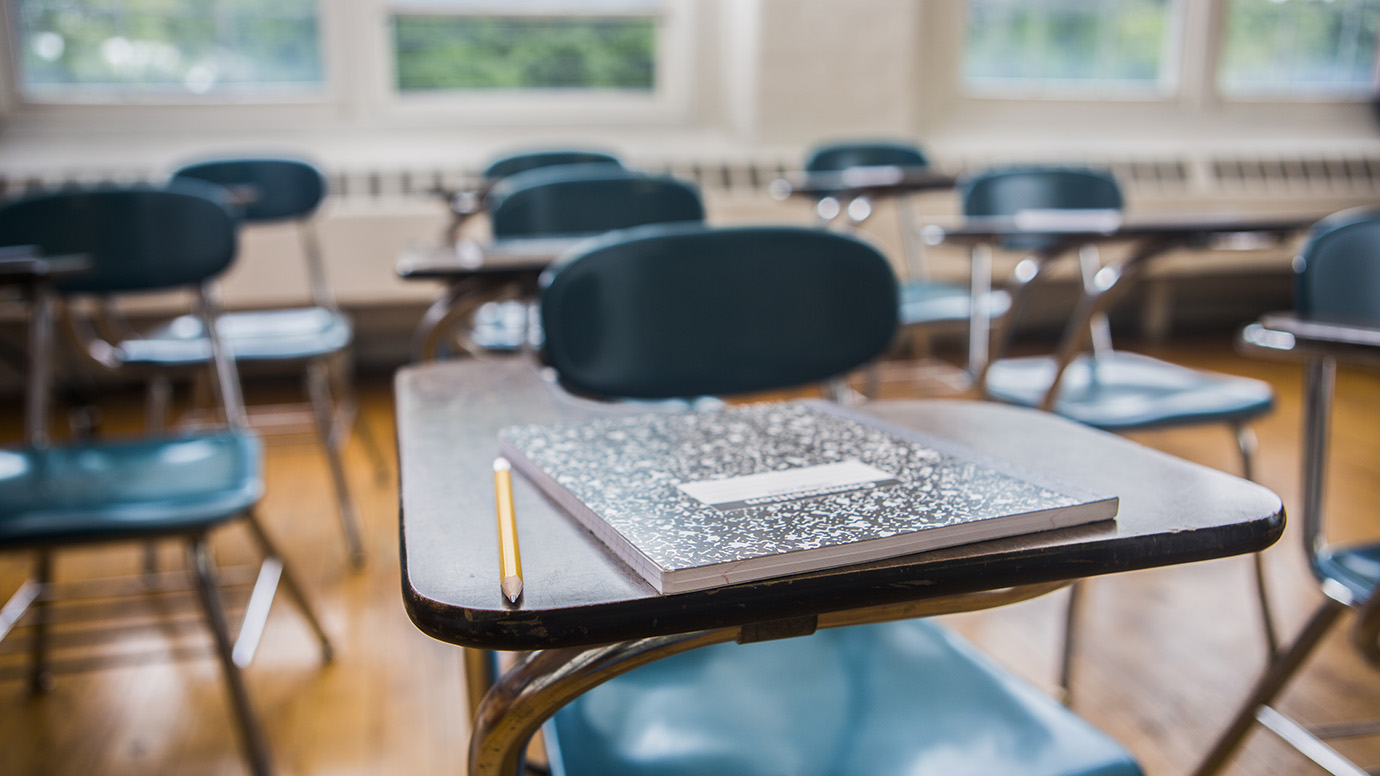 Image of desks in a classroom.