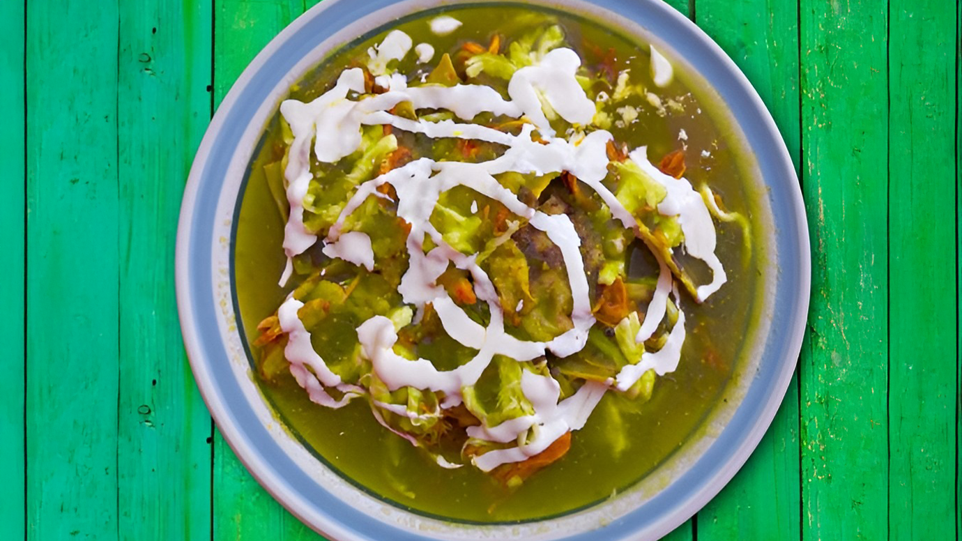 Low-carb chicken chilaquiles with green salsa on a plate.