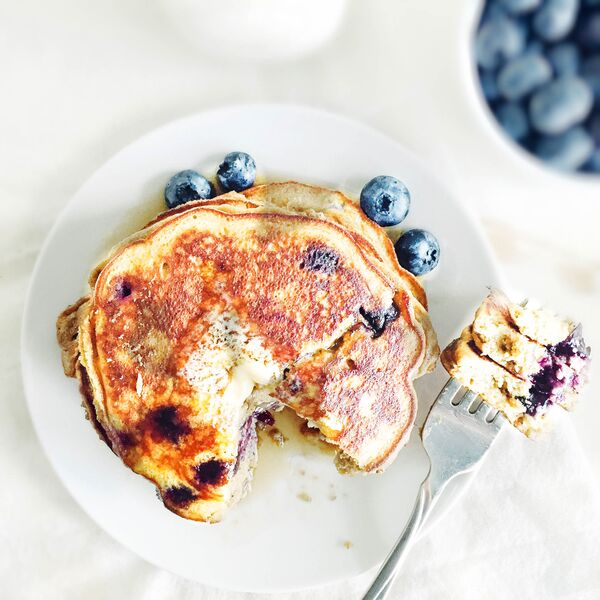 Coconut flour blueberry pancakes on a plate.