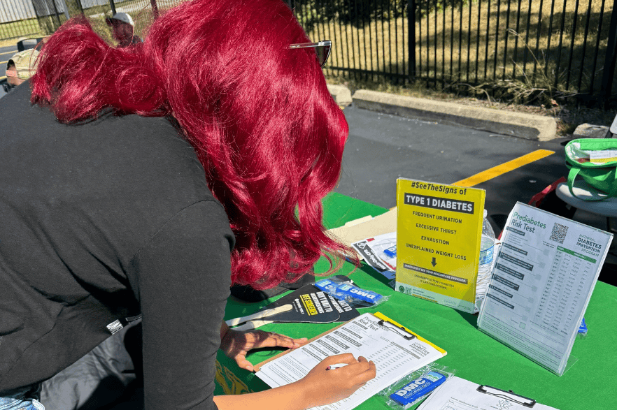 Woman signing up for information