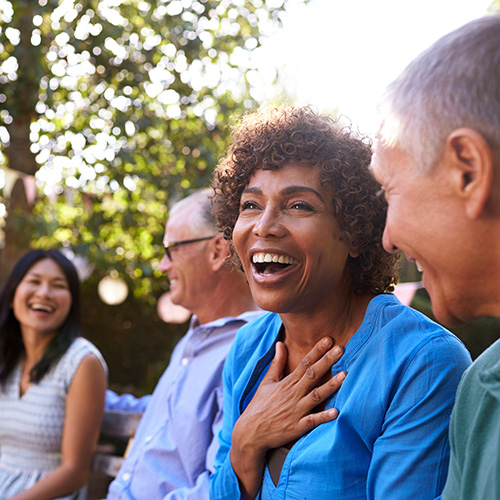 Older group of people laughing together