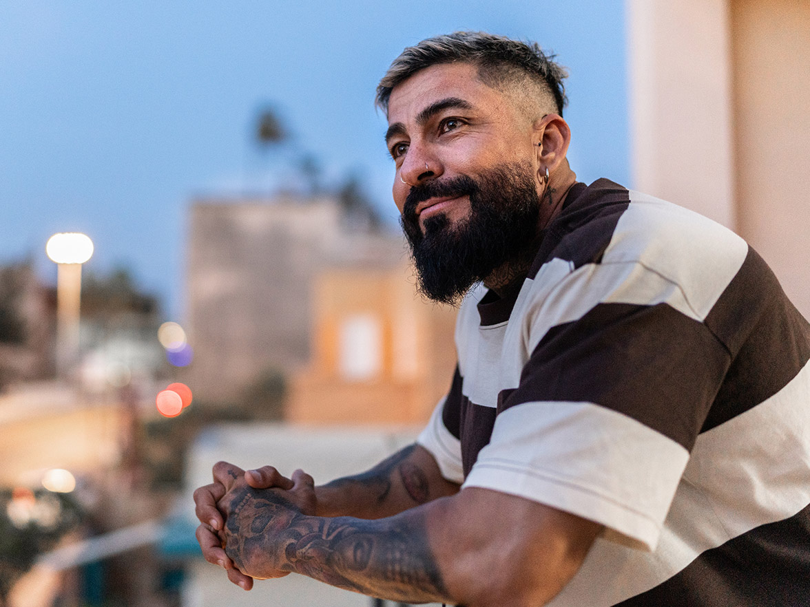 Man smiling on balcony
