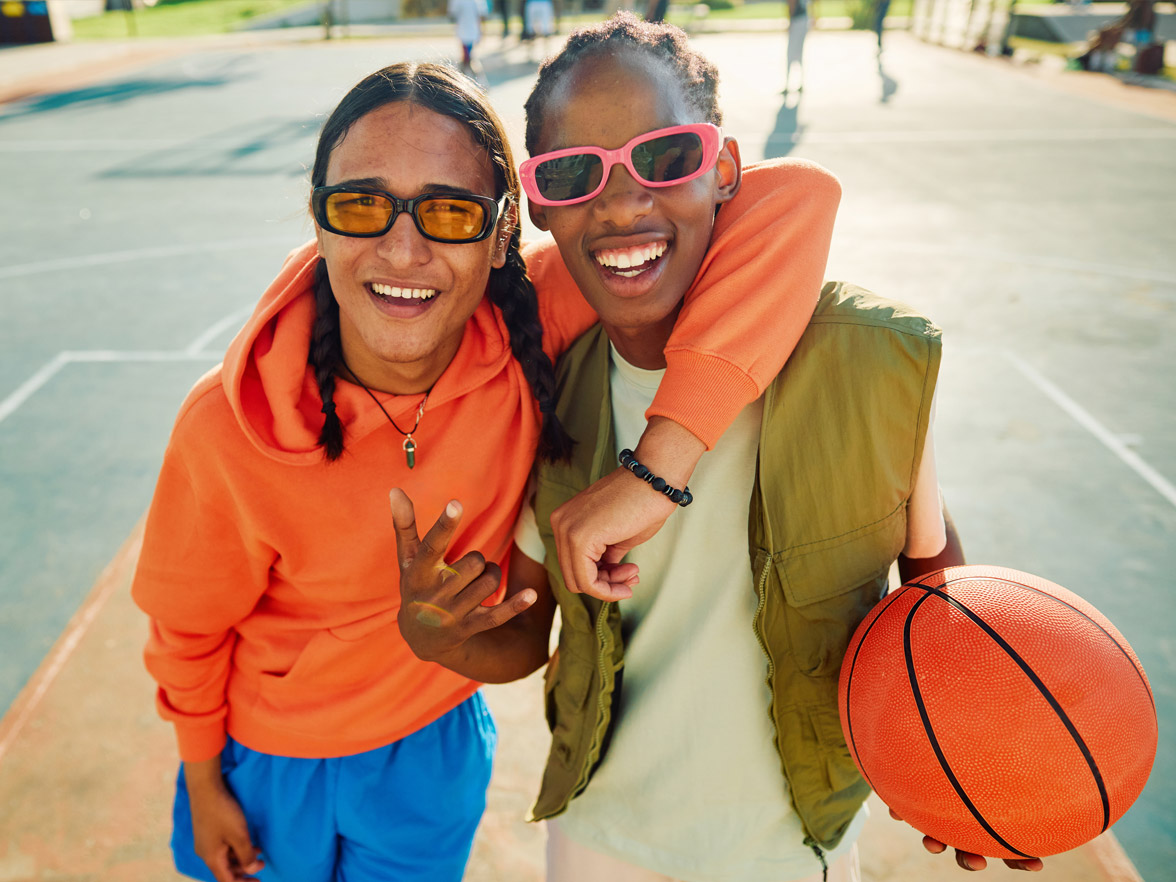Friends playing basketball