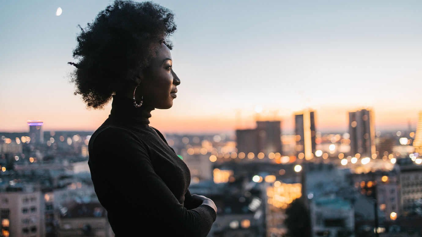 Woman taking in the city skyline.