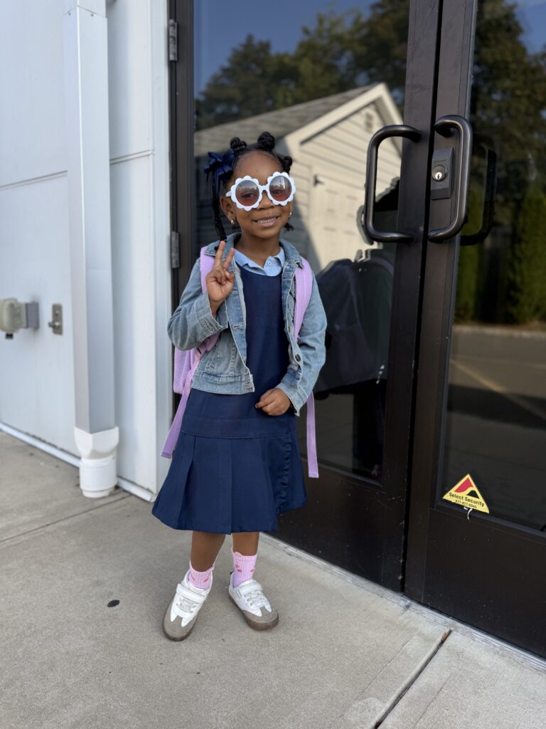 Ariel's daughter being dropped off at school.