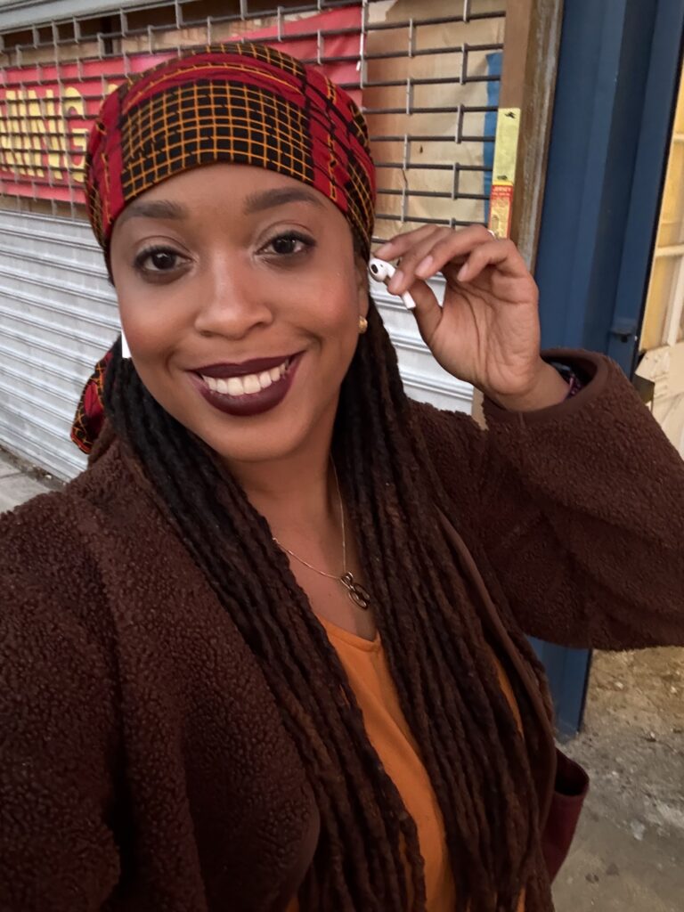 Ariel poses with her earphone while on a Zoom call.