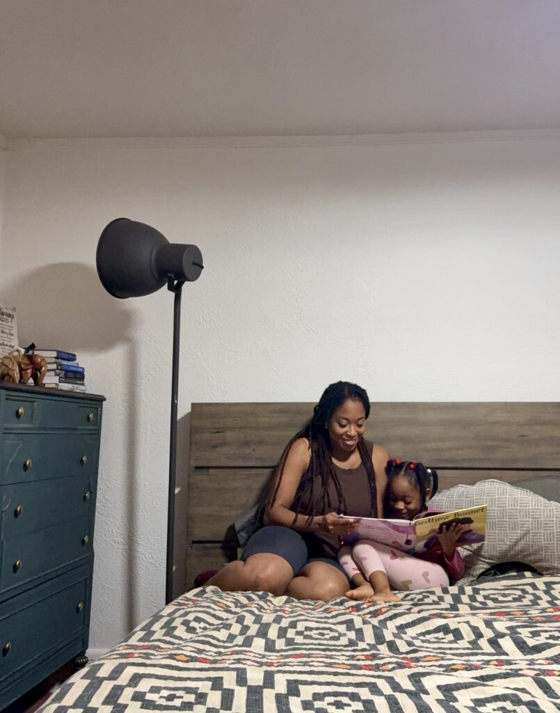 Ariel and her daughter read at bedtime.