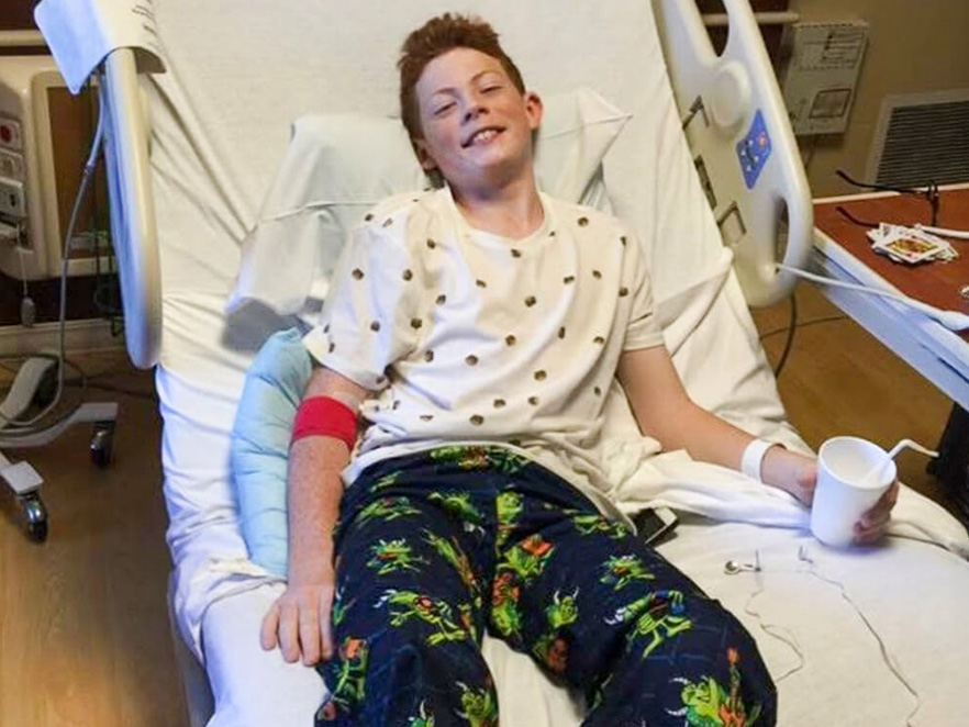 Cooper lays in hospital bed after being diagnosed with type 1 diabetes.