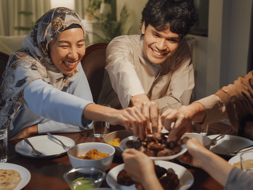 People gather around the table for a meal.