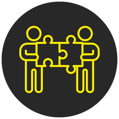 Two people connecting puzzle pieces