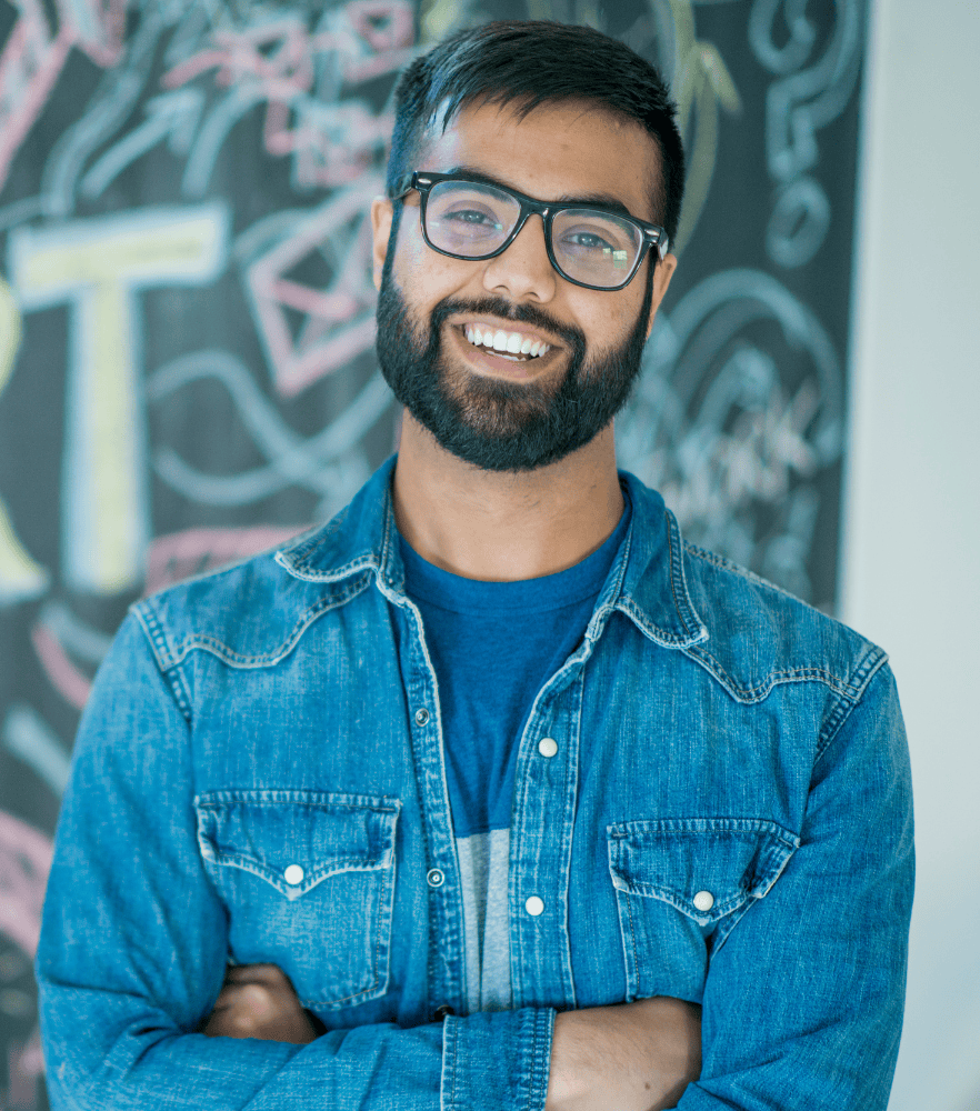 Man with glasses smiling