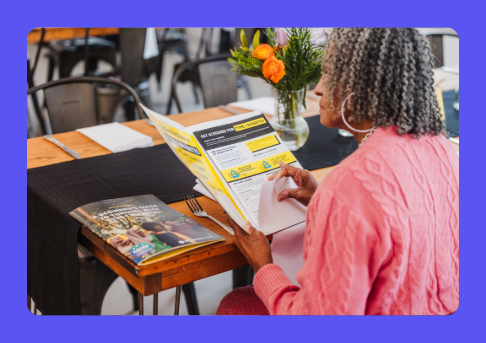 Woman reading pamphlet