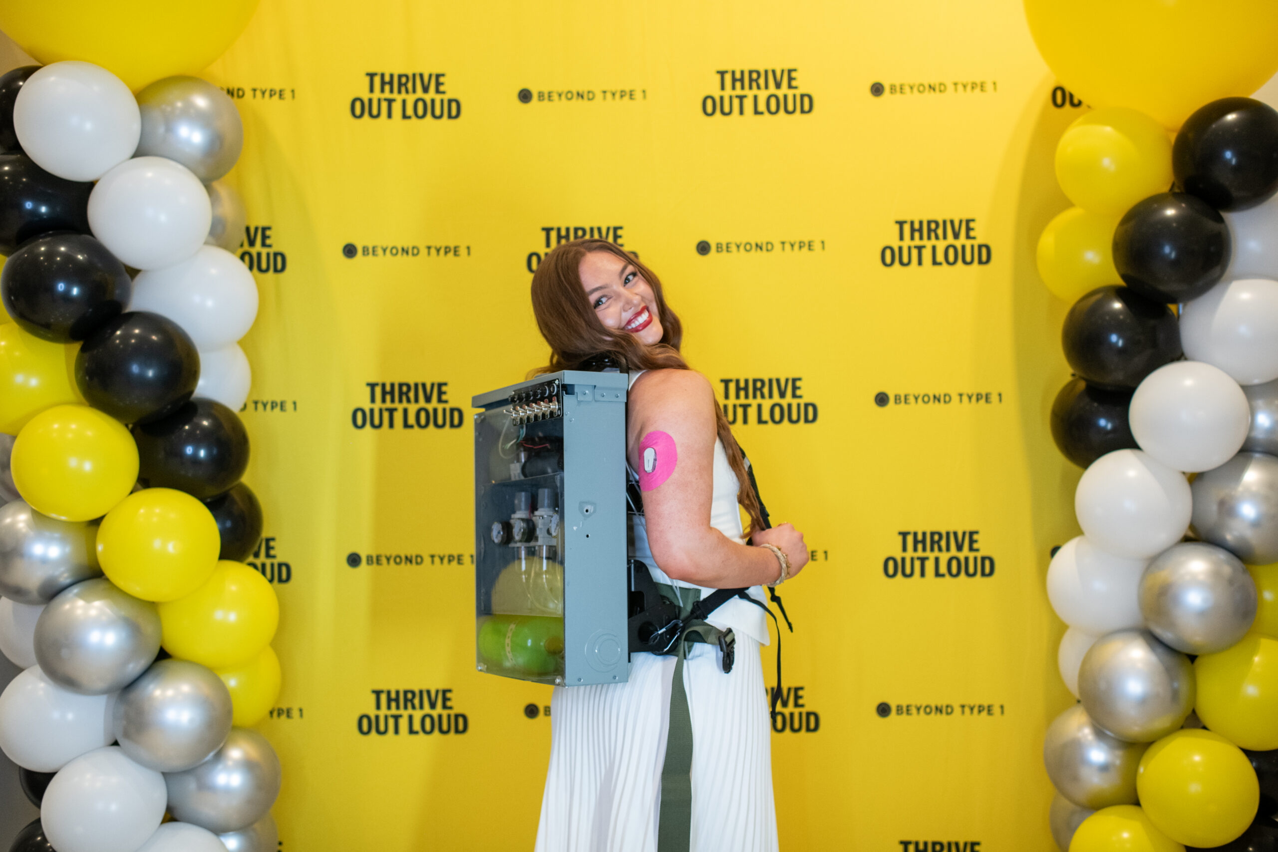 Woman holding insulin backpack prop