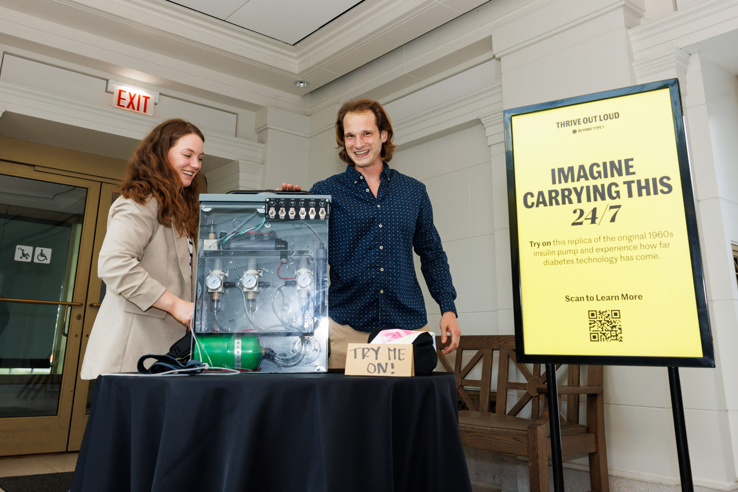 man and woman looking at insulin backpack prop